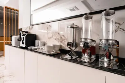 a kitchen with a counter with appliances on it at G Star Hotel in Sutomore