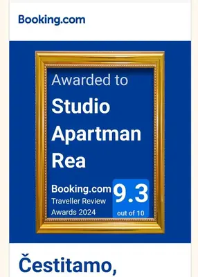 a picture of a picture frame with a sign that reads awarded to studio apartmentarian at Studio Apartman Rea in Kotor