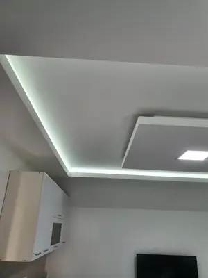 a white ceiling with a light in a room at Apartman Tolosi 2 in Podgorica