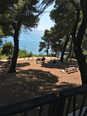 a park with benches and a view of the ocean at Apartman A1 in Ulcinj