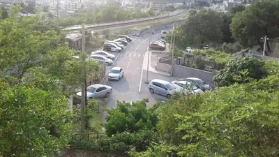 a bunch of cars parked in a parking lot at Holiday home Panorama in Sutomore