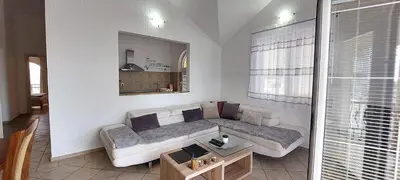 a living room with a couch and a table at D & S Family Apartments Budva in Budva