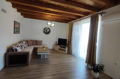 a living room with a couch and a table at Holiday home N&S in Bar