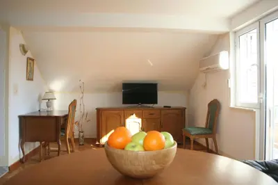 a bowl of fruit sitting on top of a table at Spacious 2Bedroom Flat Budva Becici in Boreti