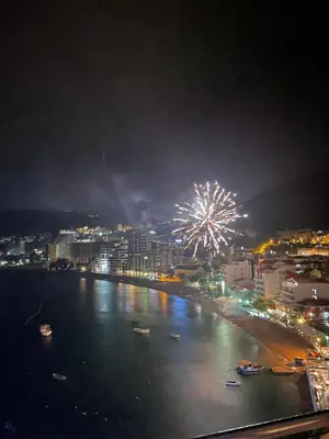 a firework display over the water at night at Workation Panorama Escape in Budva
