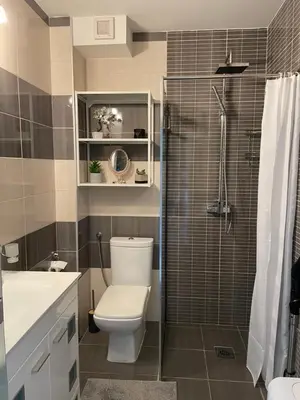 a bathroom with a toilet and a shower at Workation Panorama Escape in Budva