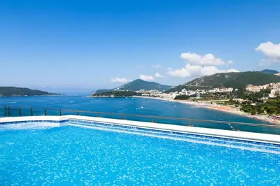 a swimming pool with a view of the beach at Workation Panorama Escape in Budva