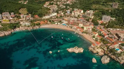 an aerial view of a beach with a resort at Sunset Poolside Retreat BlueH in Budva