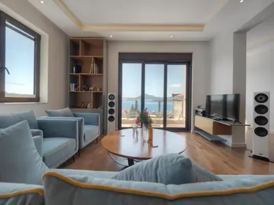 a living room with a couch and a table at Luxury apartment with Sea view Przno, Sveti Stefan, Regina Residence in Pržno