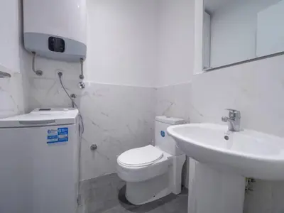 a bathroom with a white toilet and a sink at Luxury apartment with Sea view Przno, Sveti Stefan, Regina Residence in Pržno