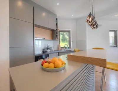a kitchen with a bowl of fruit on a counter at Luxury apartment with Sea view Przno, Sveti Stefan, Regina Residence in Pržno