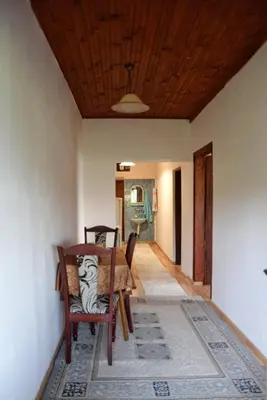 a dining room with a table and chairs and a ceiling at house for rent 