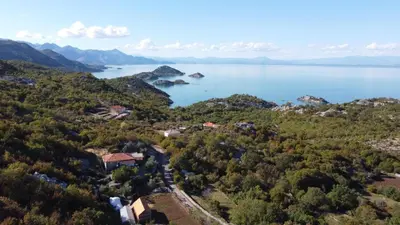 an aerial view of a lake with houses and trees at house for rent 