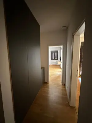 an empty room with a hallway leading to a living room at Apartman Jedro Lux in Rafailovici