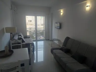a living room with a couch and a table at Apartman Centar Bar in Bar