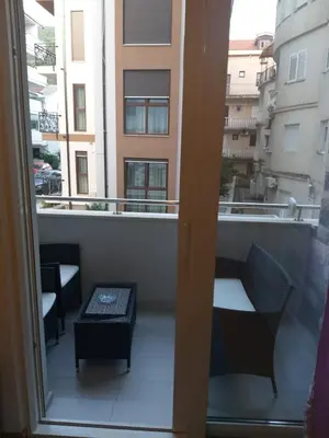 a view of a balcony with a bench and a window at Apartment Joković in Budva