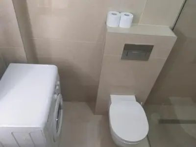 a bathroom with a toilet and two rolls of toilet paper at Apartment Joković in Budva