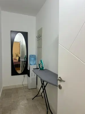 a room with a table and a mirror at DIKA Apartment in Bar