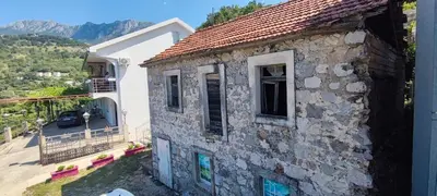a stone house with a view of the mountains at DIKA Apartment in Bar
