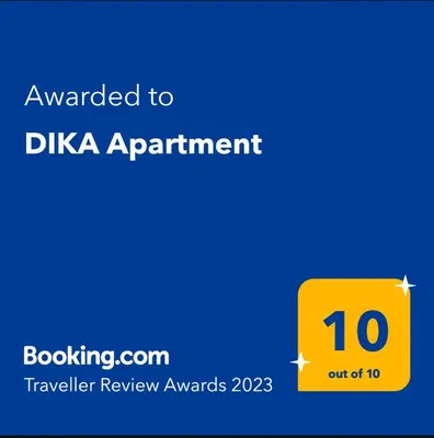 a yellow sign with the text awarded to dka appointment at DIKA Apartment in Bar
