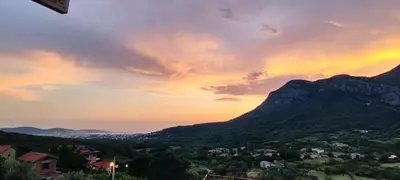 a view of a mountain with a rainbow in the sky at DIKA Apartment in Bar