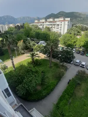 a view of a park with trees and a parking lot at Carpe diem in Bar