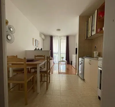 a kitchen and dining room with a table and a dining room at Carpe diem in Bar