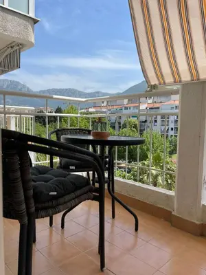a balcony with a table and chairs and a view at Carpe diem in Bar