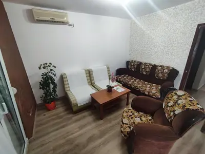 a living room with a couch and a table at Apartmani Bellami in Becici
