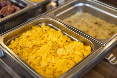 a metal container filled with macaroni and cheese at N Hotel in Sutomore