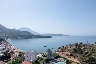 a view of a city and a body of water at N Hotel in Sutomore