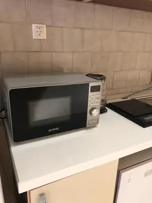 a microwave sitting on top of a counter at Апартаменты Jasmine in Bar