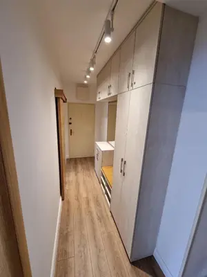 a room with cabinets and a hallway with wood floors at Golden Fields Apartment near the Old Town in Kotor