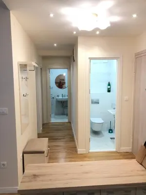 a bathroom with a toilet and a sink at SunshineLiving, Bar in Bar