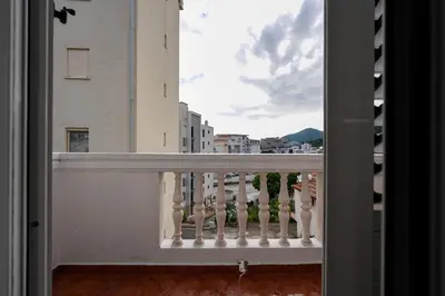 a balcony with a view of a city at Porta Volta Apartments in Becici