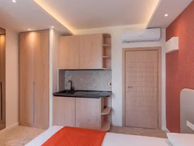 a small kitchen with a sink and a door at Vila Gina in Bar
