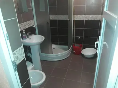 a bathroom with a shower and a sink and a toilet at Studios Milošev in Bar