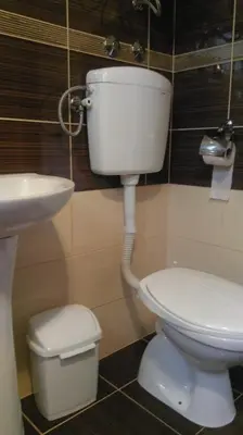 a bathroom with a toilet and a sink at Studios Milošev in Bar
