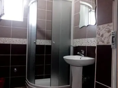 a bathroom with a sink and a shower at Studios Milošev in Bar