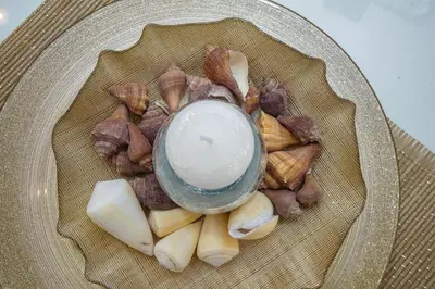 a bowl of food on a plate with nuts at Apartments Lidija in Petrovac na Moru