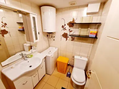 a small bathroom with a sink and a toilet at Olimp lux III in Budva