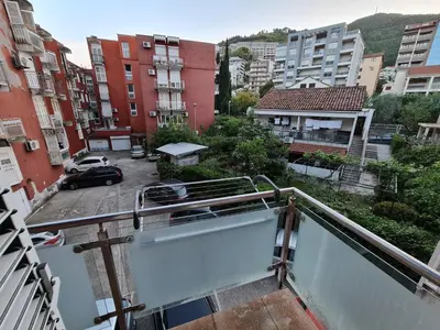 a balcony with a view of a parking lot at Olimp lux III in Budva