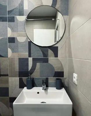 a bathroom with a white sink and a mirror at Danin apartmani in Bar