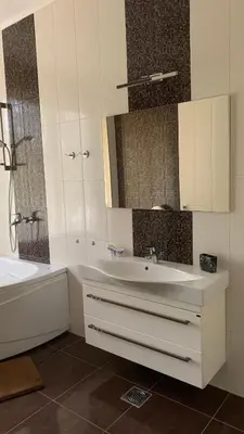 a bathroom with a sink and a tub and a mirror at Villa Premium S in Bar
