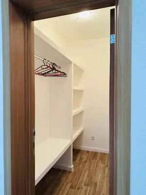 a walk in closet with a pair of shoes at Apartmani Sunce in Bar
