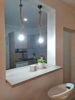 a kitchen with a counter with a toilet in it at Harmony in Radanovići
