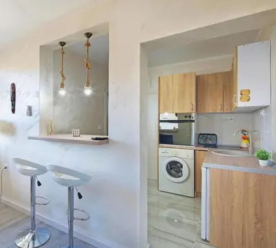 a kitchen with a counter and a sink and a stove at Harmony in Radanovići
