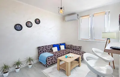 a living room with a couch and a table at Harmony in Radanovići