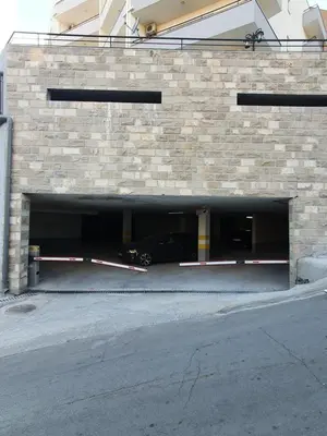 a car is parked inside of a parking garage at Apartman Bečiči - Budva - Free Parking in Budva