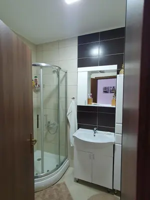 a bathroom with a glass shower and a sink at Apartman Bečiči - Budva - Free Parking in Budva
